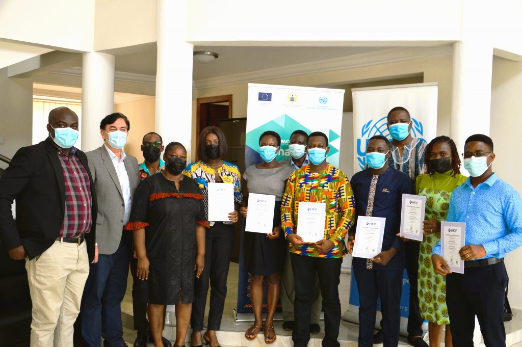 Successful experts holding their certificates in a group photo with UNIDO Representative to Ghana and Liberia 2nd left and Mr. Charles Kwame Sackey in smock3rd left WACOMP – Ghana Supports Nine Experts to be IRCA Certified ISO 22000 Lead Auditors